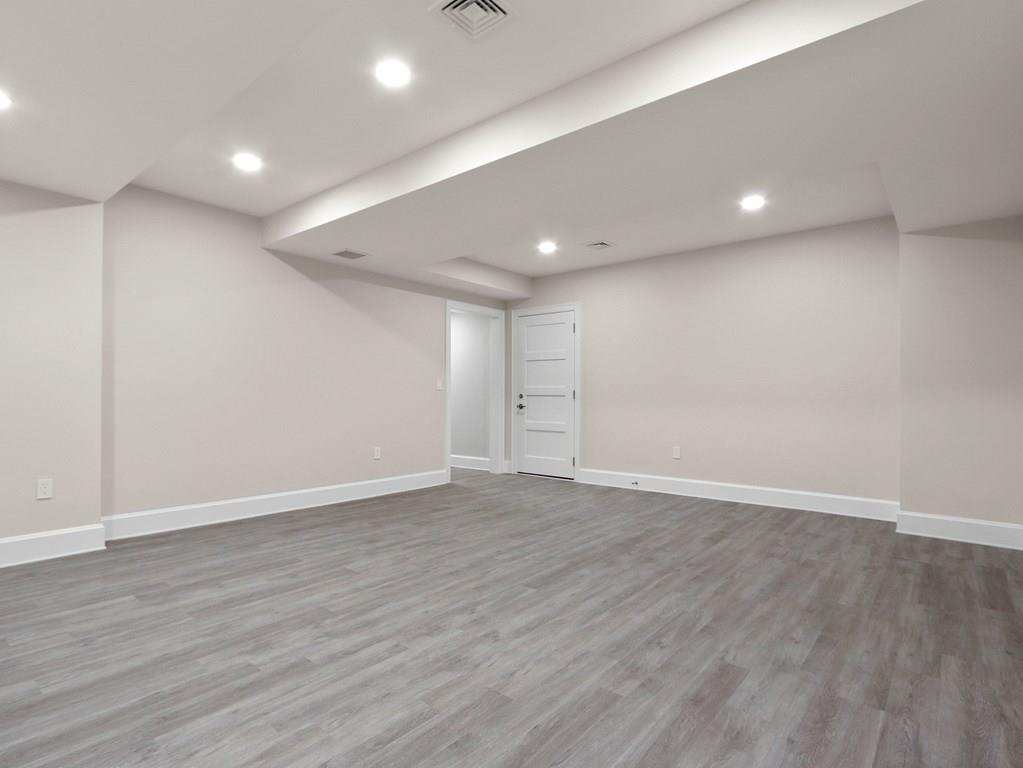 30 Columbine Road Newton, MA 02459 - Photo 31 of 35 a view of an empty room with wooden floor