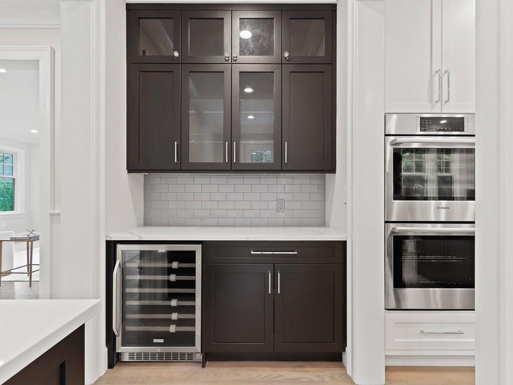 30 Columbine Road Newton, MA 02459 - Photo 8 of 35 a kitchen with granite countertop a stove and a microwave