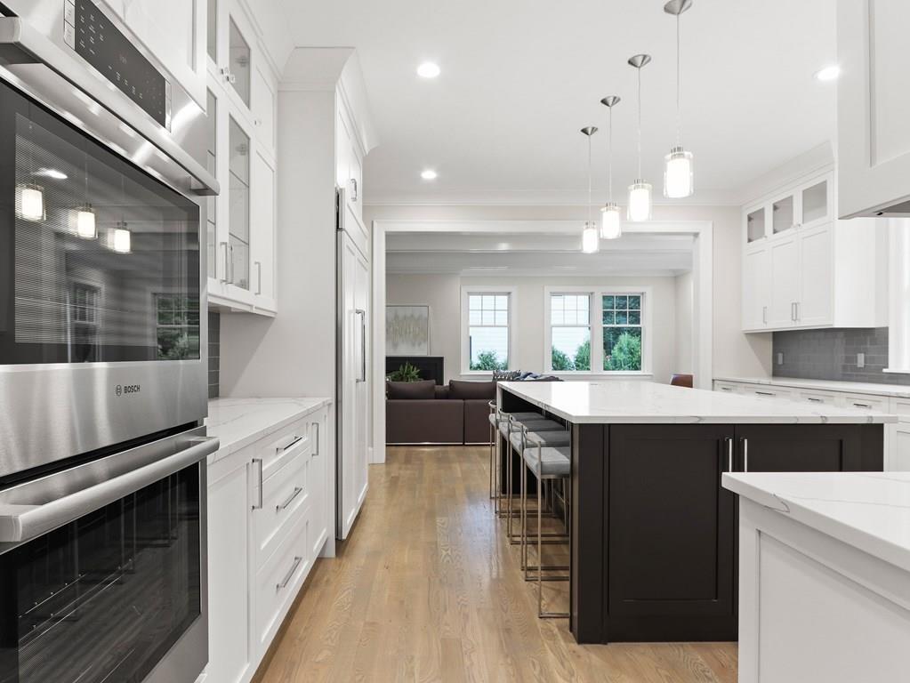 30 Columbine Road Newton, MA 02459 - Photo 9 of 35 a kitchen with kitchen island a sink appliances and cabinets