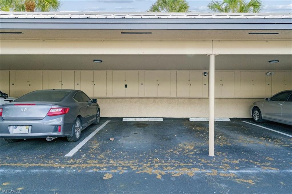 75 St Andrews Boulevard, Unit C301 Naples, FL 34113 - Photo 24 of 41 a car parked in a parking space