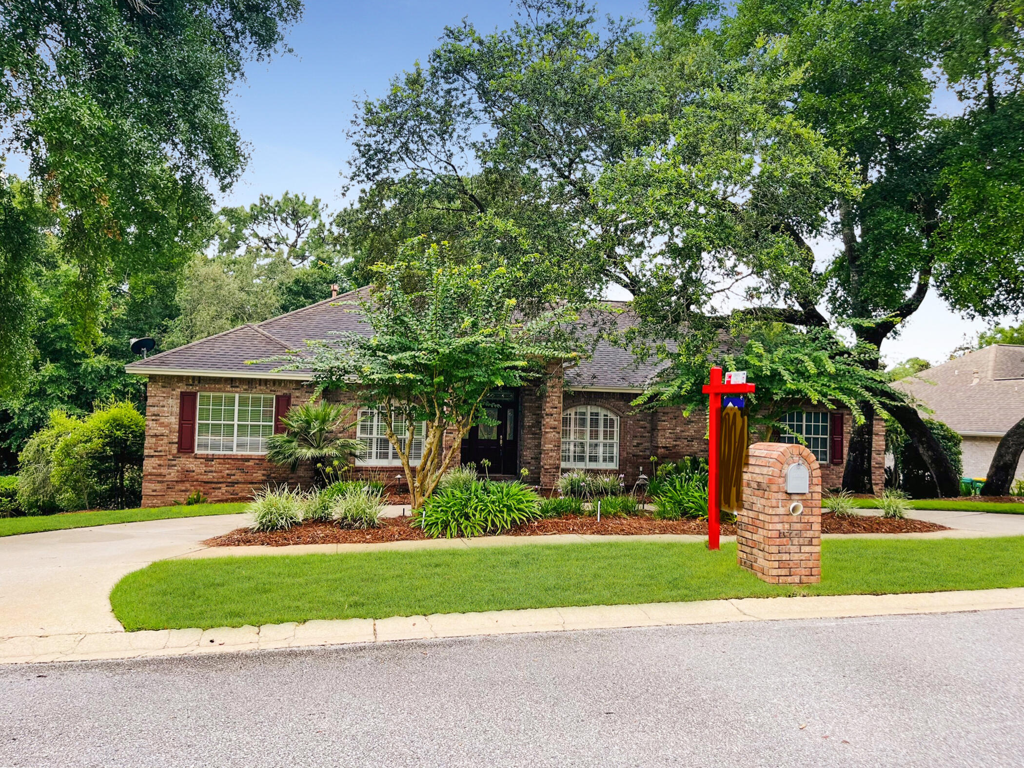 4100 Howard Drive Niceville, FL 32578 - Photo 1 of 133 a front view of a house with a yard and a garage