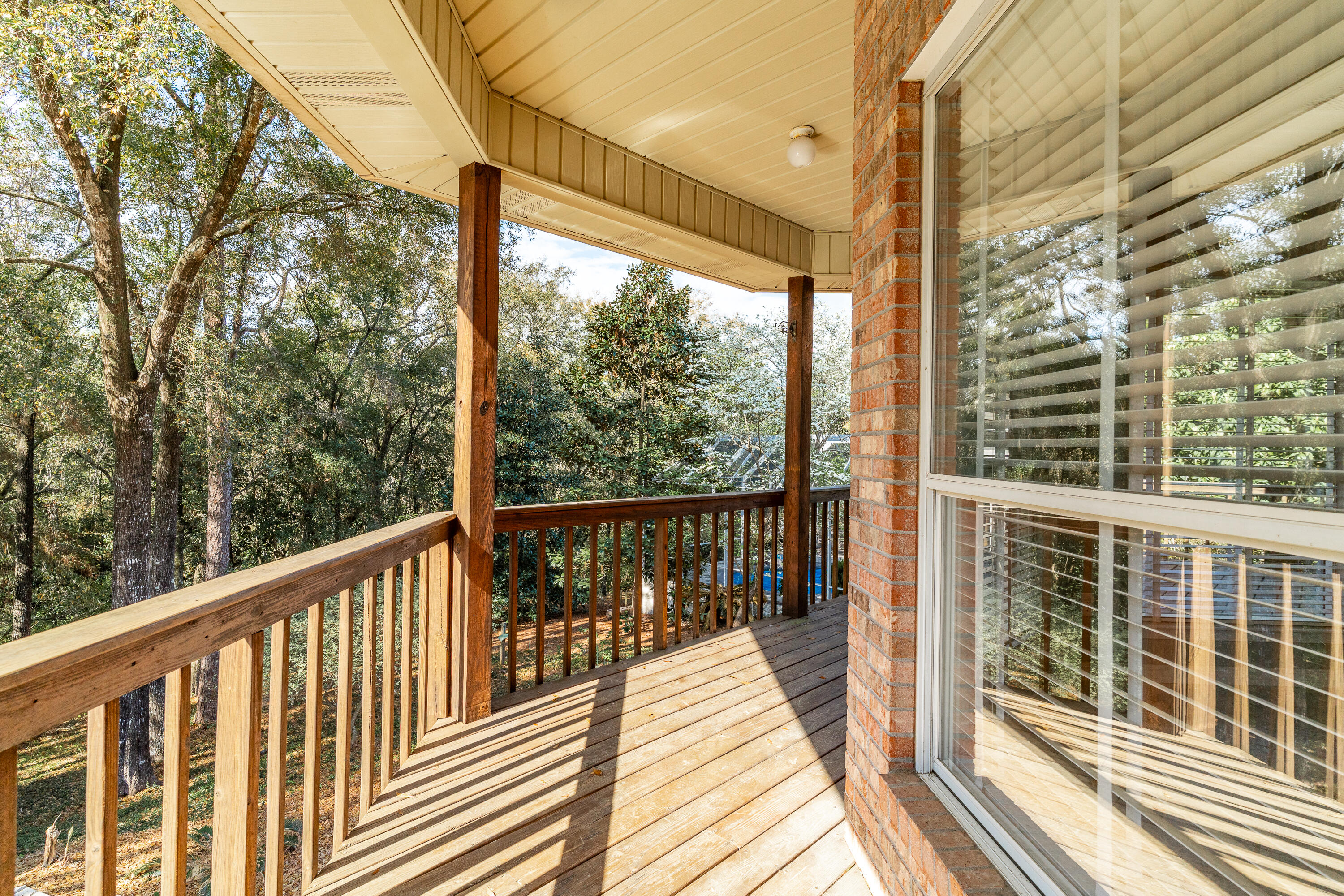 4100 Howard Drive Niceville, FL 32578 - Photo 105 of 133 a view of a balcony with wooden floor
