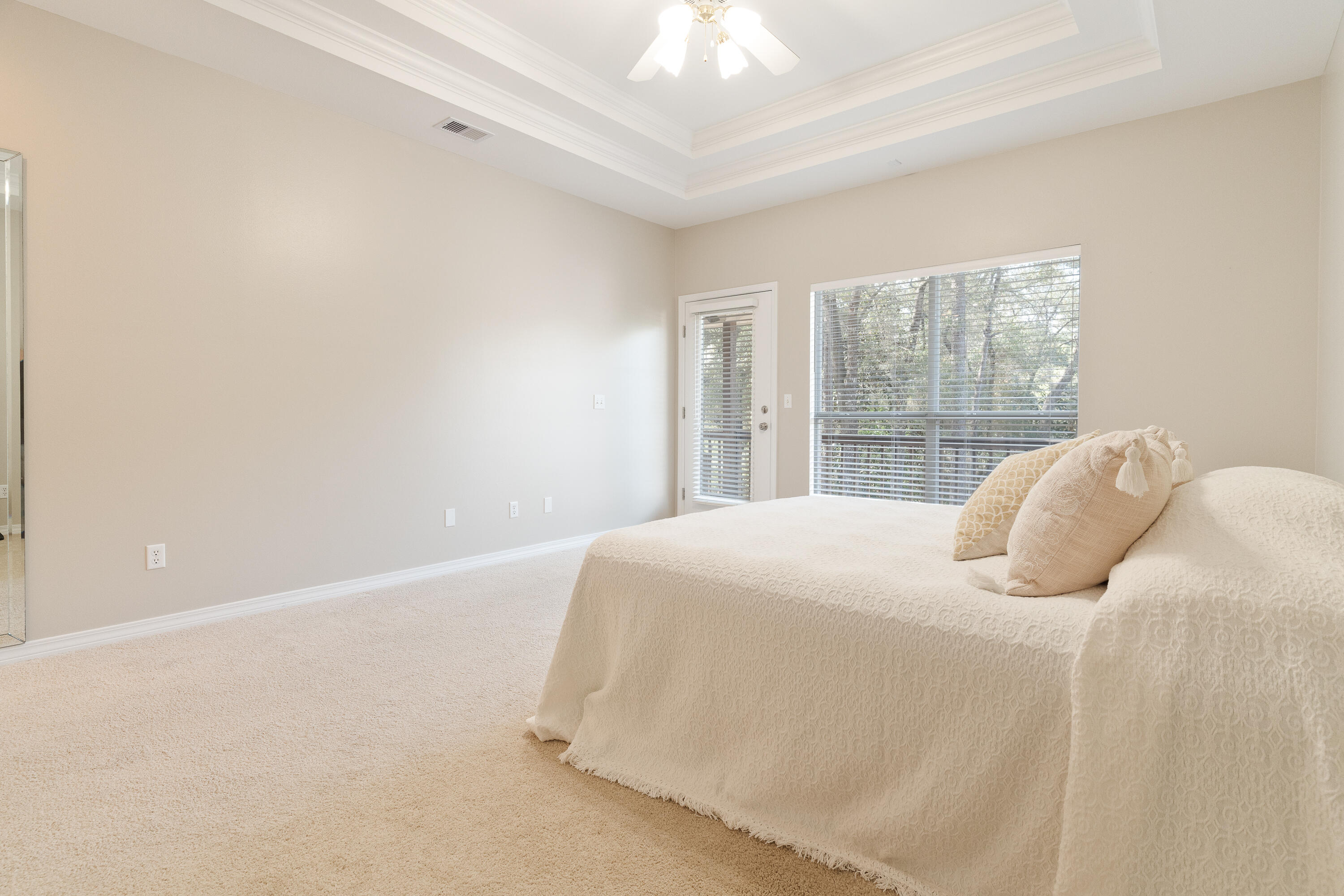 4100 Howard Drive Niceville, FL 32578 - Photo 47 of 133 a bedroom with a bed and a large window