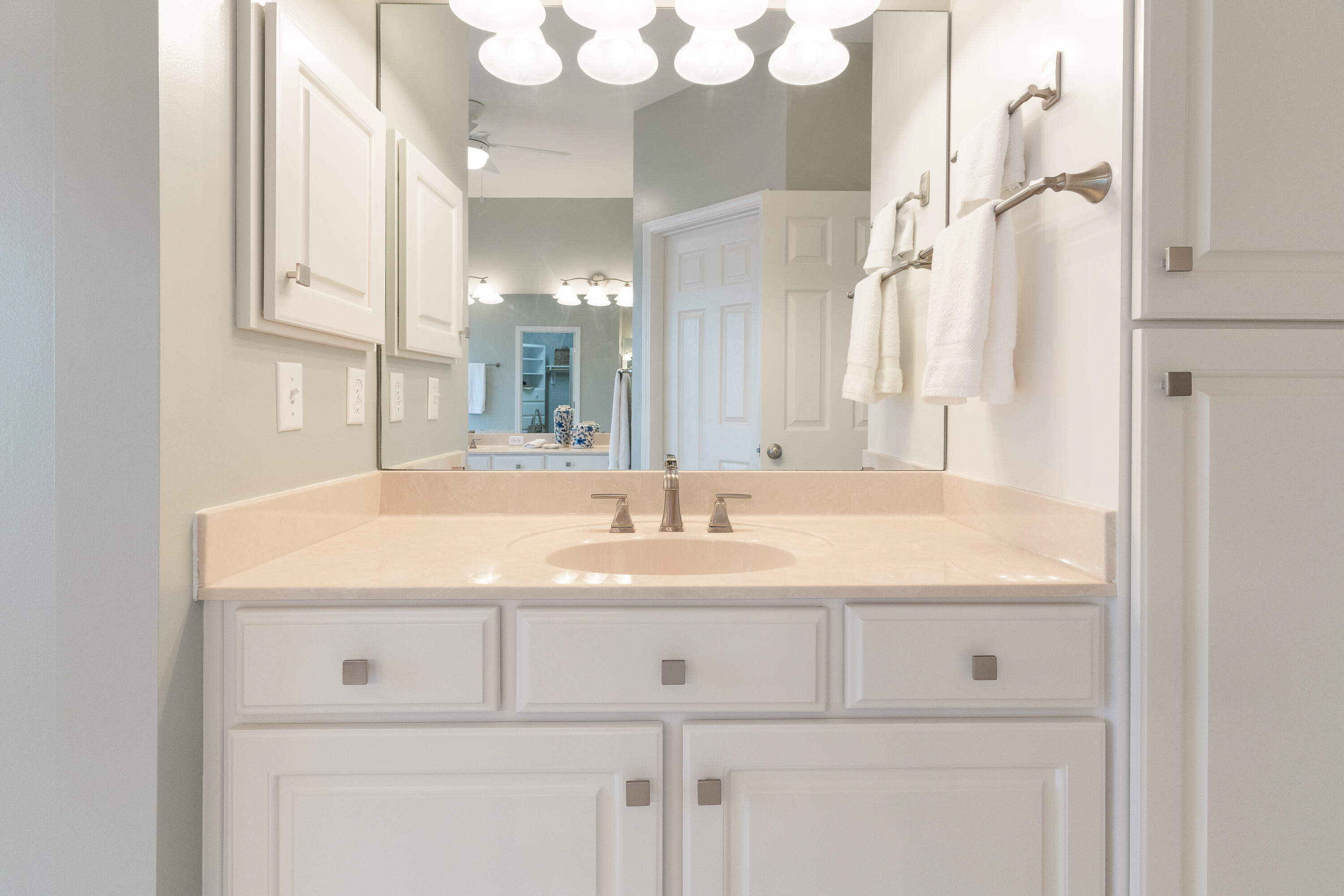 4100 Howard Drive Niceville, FL 32578 - Photo 54 of 133 a bathroom with a sink vanity and a mirror