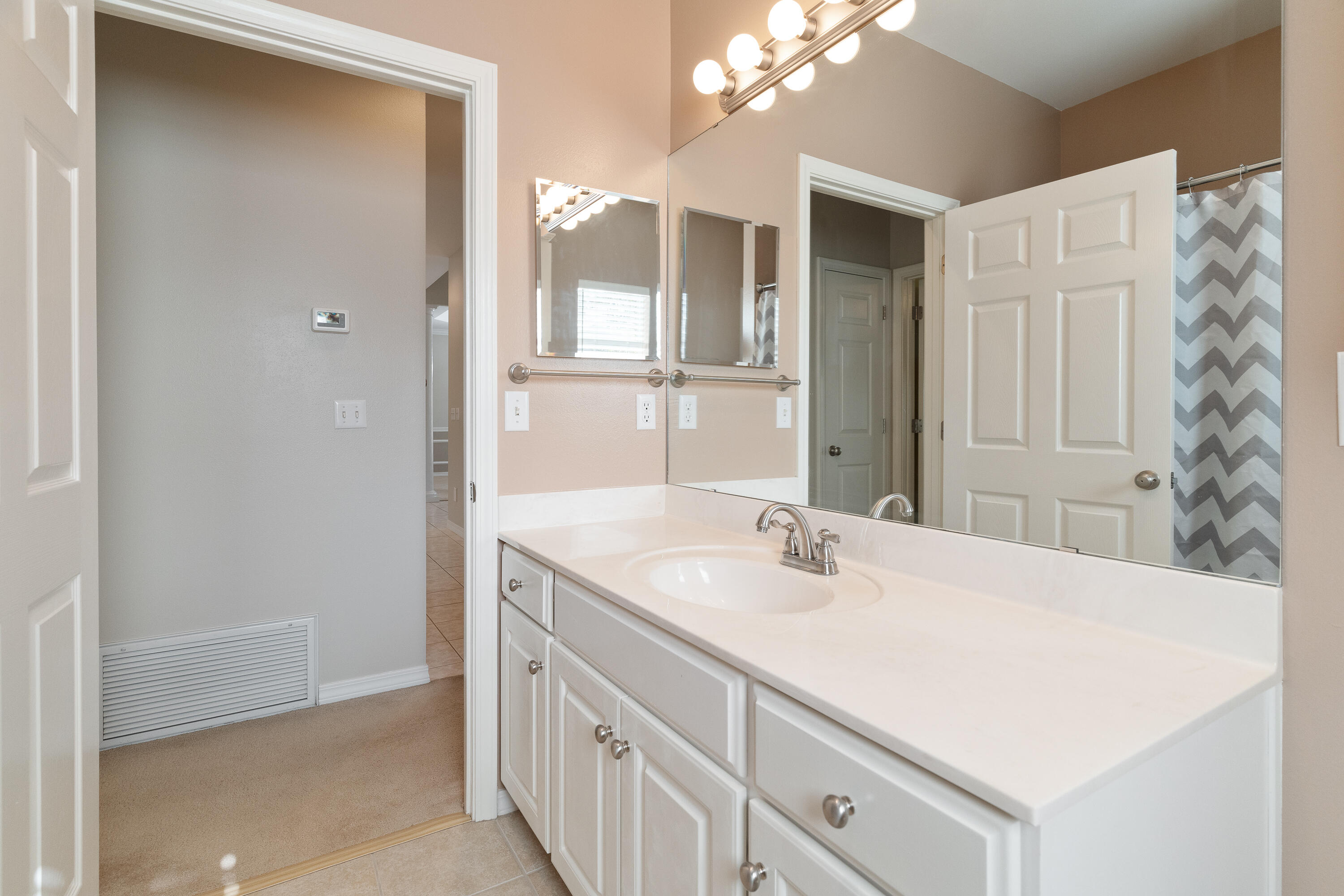 4100 Howard Drive Niceville, FL 32578 - Photo 66 of 133 a bathroom with a sink vanity granite and a mirror