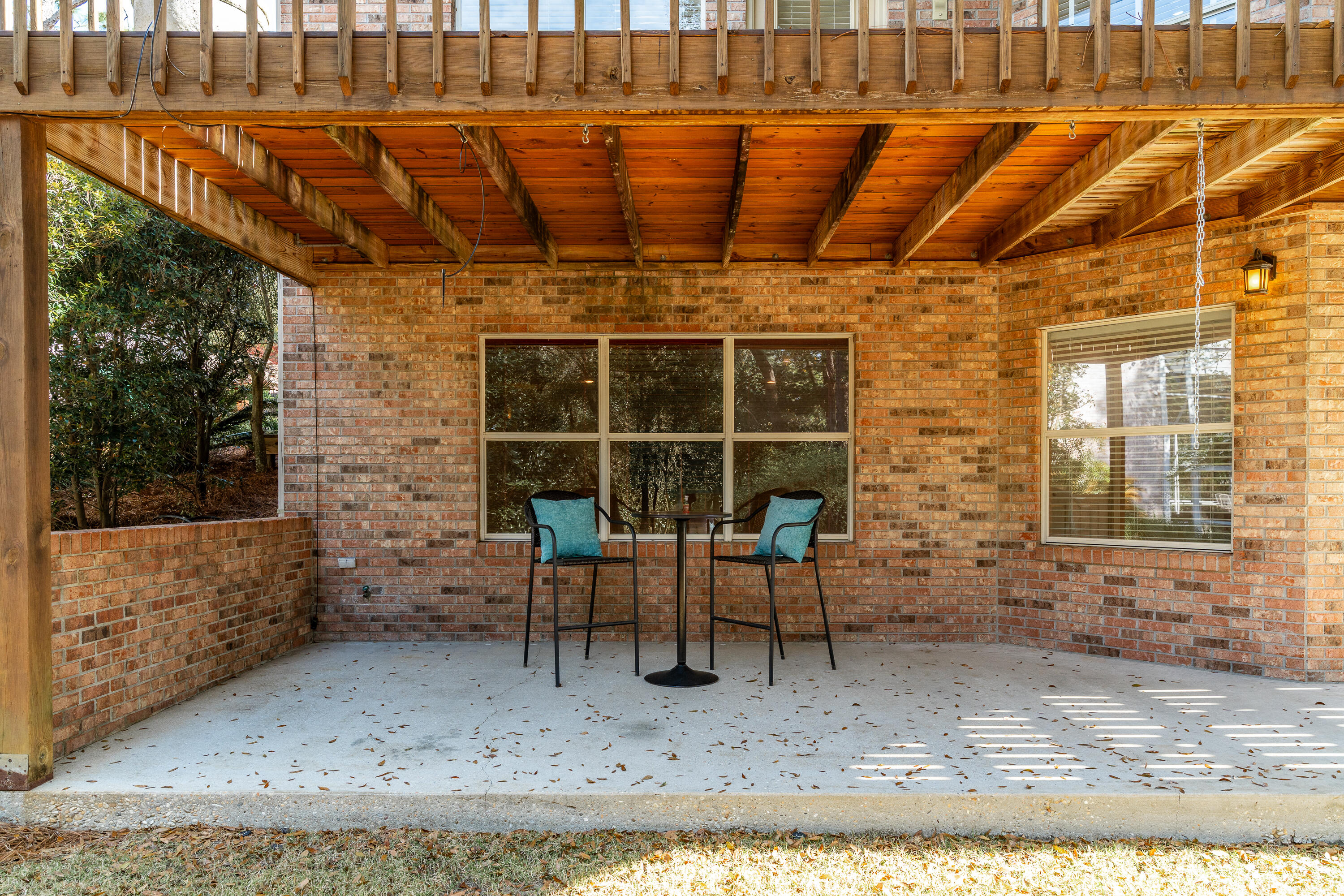 4100 Howard Drive Niceville, FL 32578 - Photo 85 of 133 a view of a porch with chairs and floor to ceiling window
