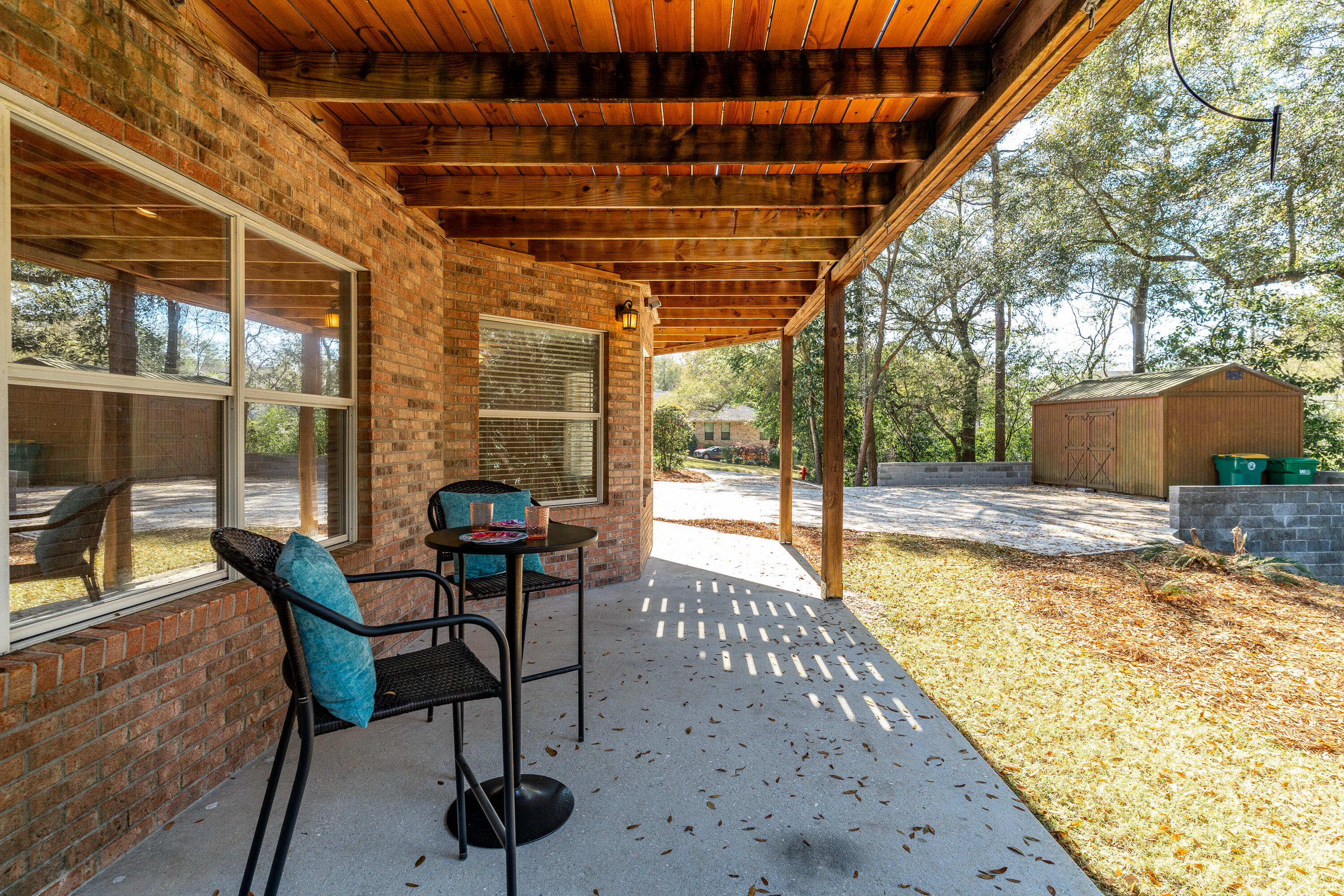 4100 Howard Drive Niceville, FL 32578 - Photo 87 of 133 a view of a porch with chairs and backyard