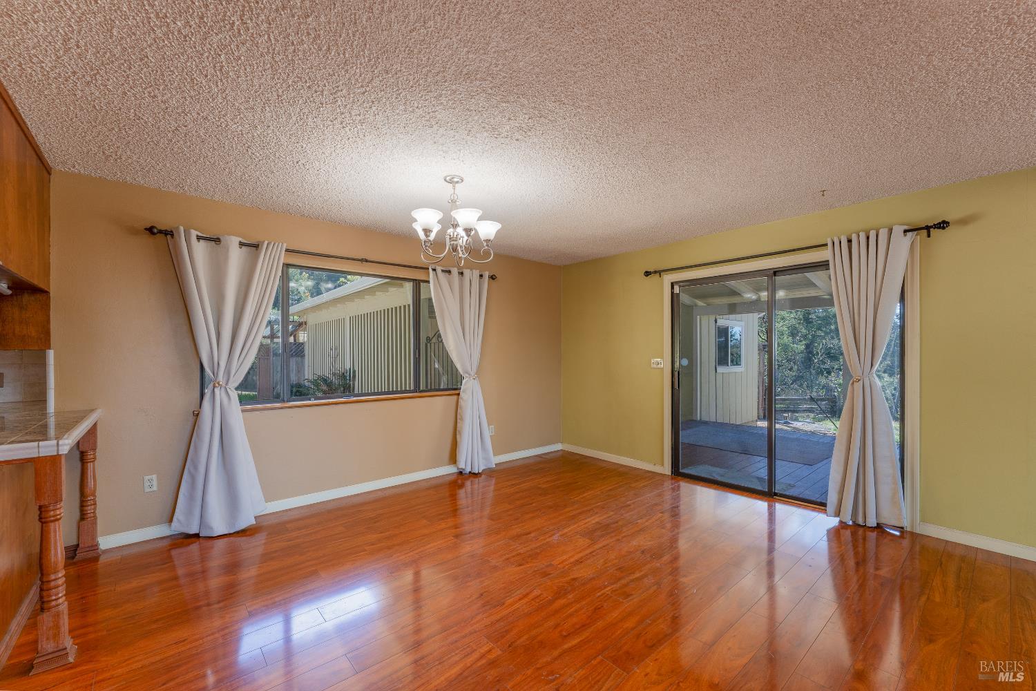 3651 Ridgewood Road Willits, CA 95490 - Photo 13 of 45 wooden floor in an empty room with a window