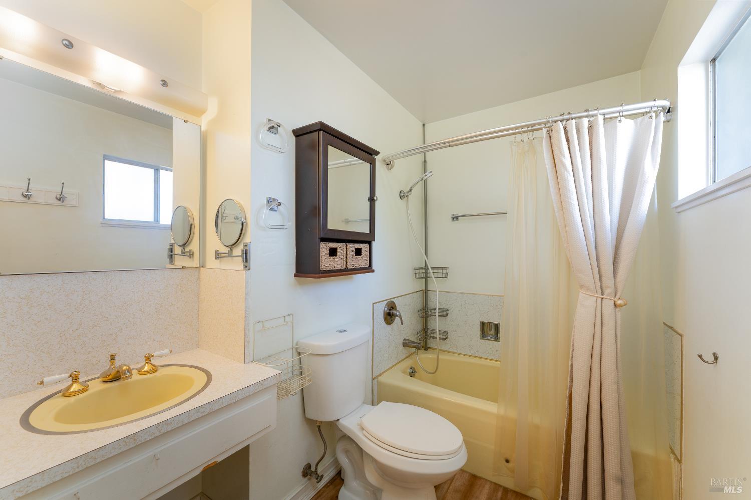 3651 Ridgewood Road Willits, CA 95490 - Photo 22 of 45 a bathroom with a toilet a sink a mirror a bathtub and shower