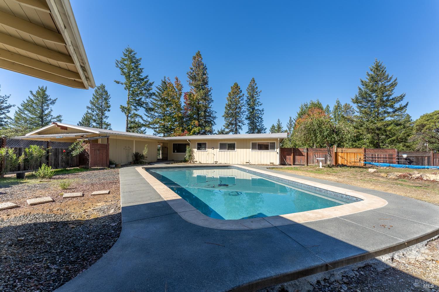 3651 Ridgewood Road Willits, CA 95490 - Photo 29 of 45 a view of a swimming pool with an outdoor space and seating area