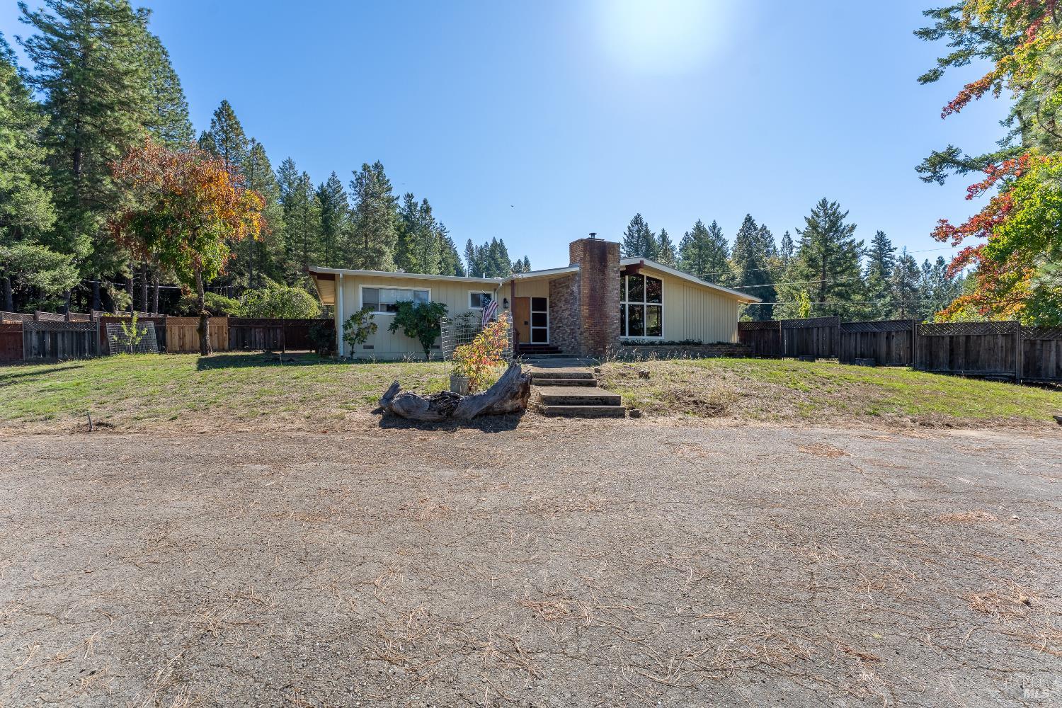 3651 Ridgewood Road Willits, CA 95490 - Photo 5 of 45 a view of a house with backyard and trees in the background