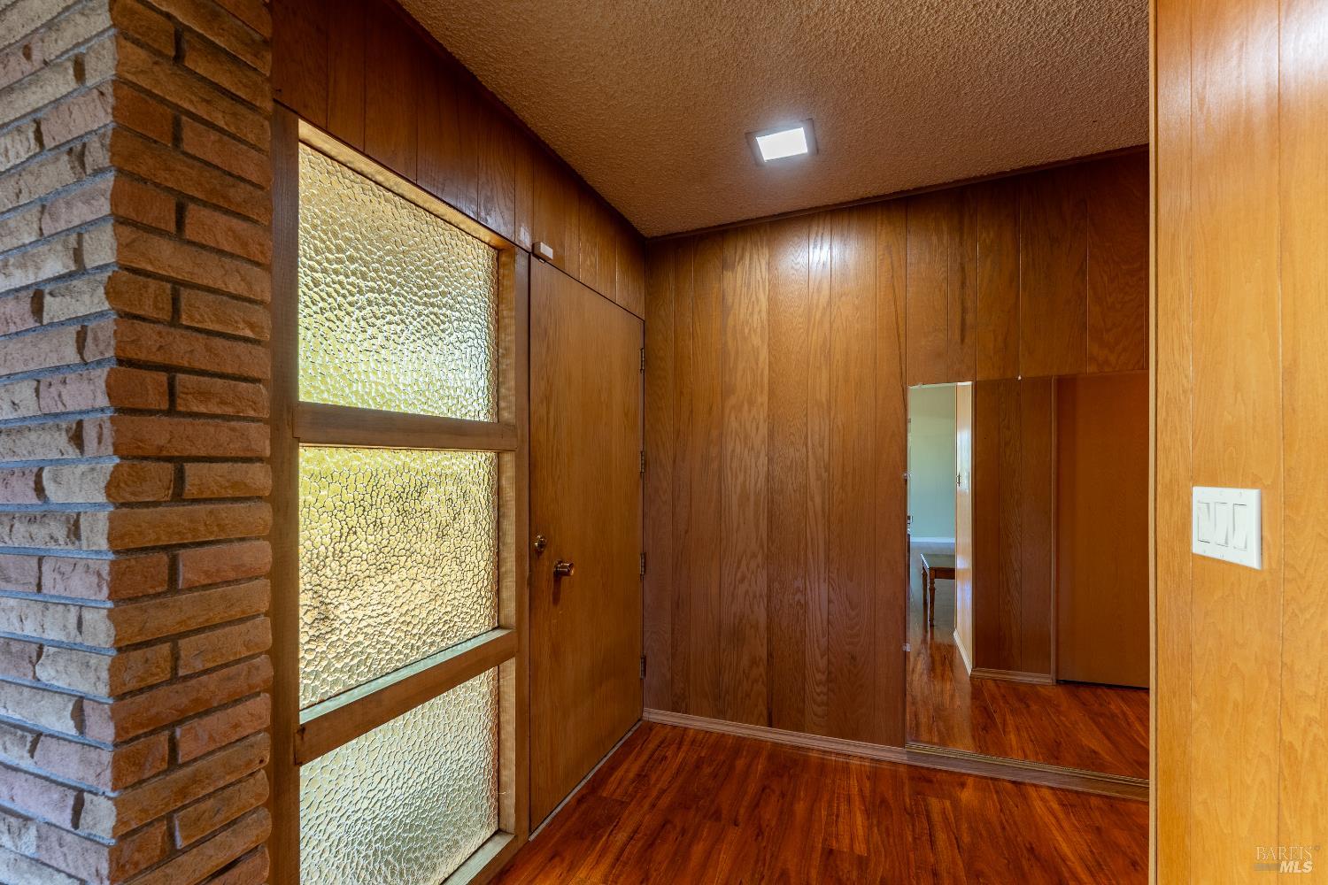 3651 Ridgewood Road Willits, CA 95490 - Photo 6 of 45 a view of an empty room with wooden floor and a window