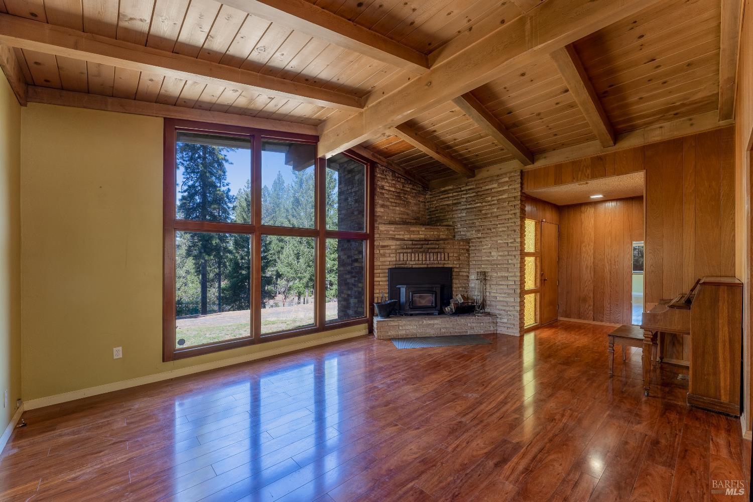3651 Ridgewood Road Willits, CA 95490 - Photo 8 of 45 a view of a livingroom with wooden floor and a fireplace