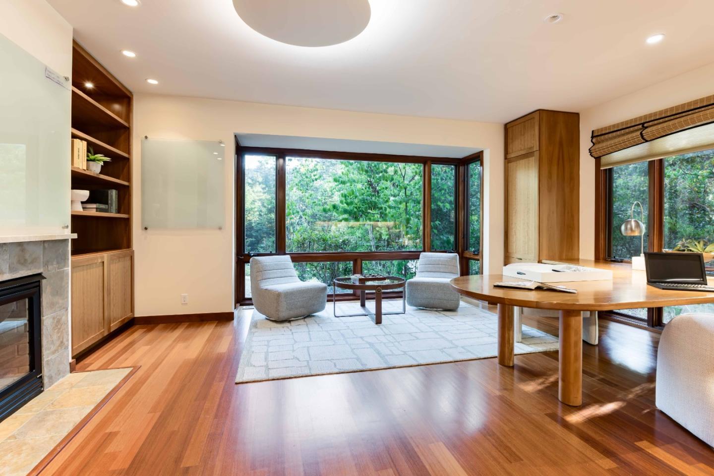 140 Farm Road Woodside, CA 94062 - Photo 12 of 39 a living room with furniture a large window and wooden floor