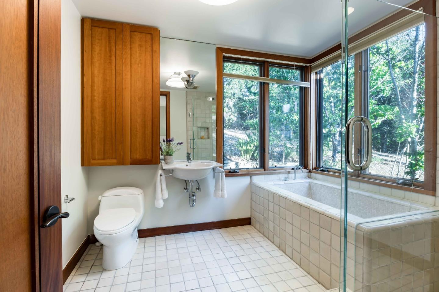 140 Farm Road Woodside, CA 94062 - Photo 16 of 39 a bathroom with a sink a bathtub and next to a window