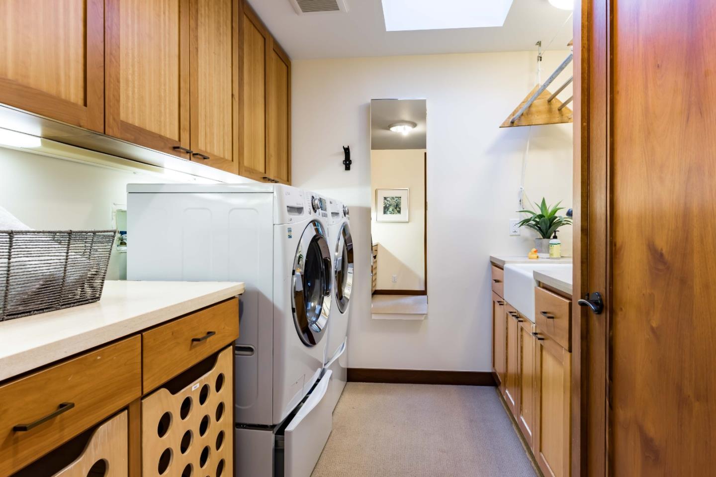140 Farm Road Woodside, CA 94062 - Photo 17 of 39 a utility room with fridge and washer