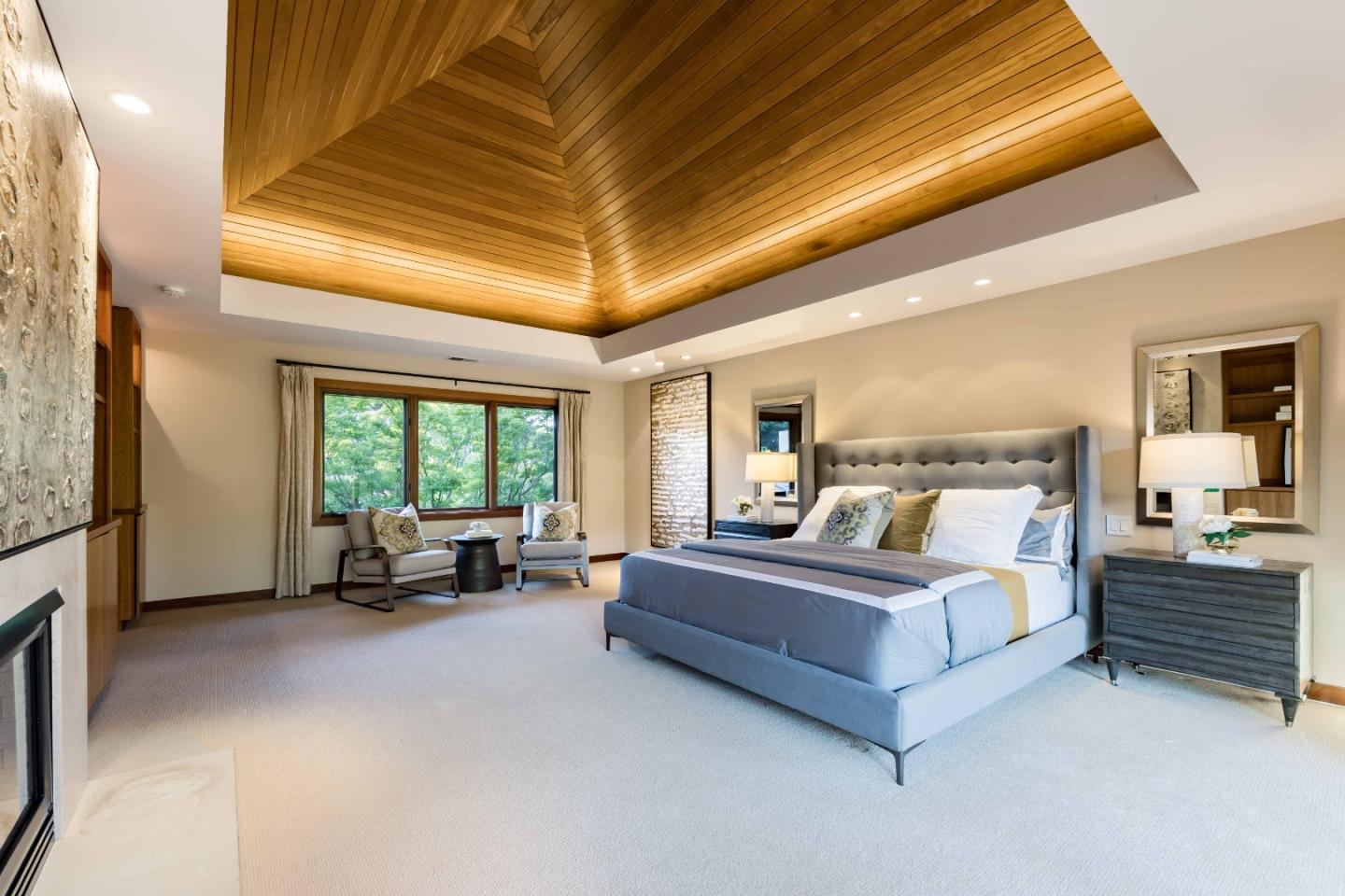 140 Farm Road Woodside, CA 94062 - Photo 20 of 39 a spacious bedroom with a bed and a chandelier