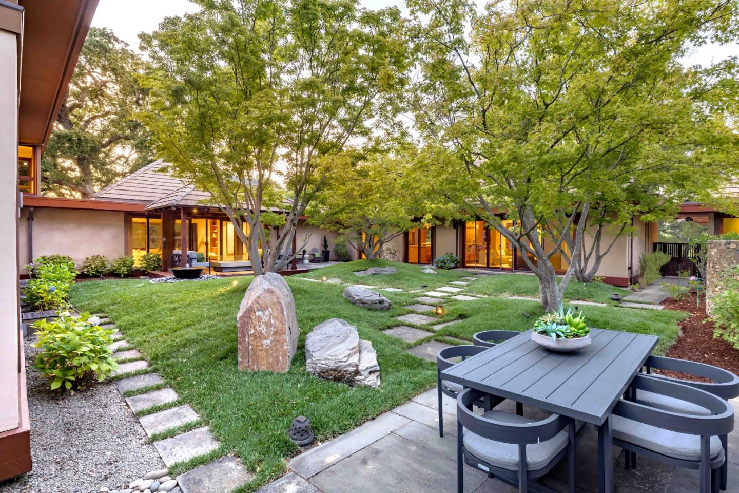 140 Farm Road Woodside, CA 94062 - Photo 25 of 39 a patio with table and chairs