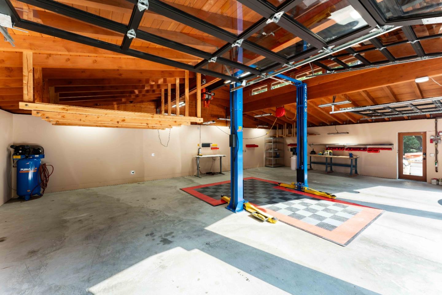 140 Farm Road Woodside, CA 94062 - Photo 33 of 39 a view of a room with wooden floor