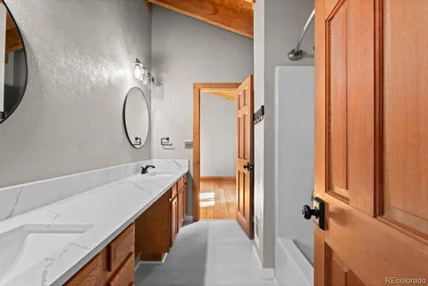 a view of outdoor space with wooden floor and windows