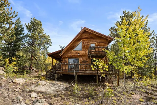 a view of balcony with wooden floor and fence