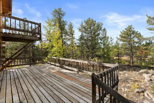 a view of balcony with wooden floor