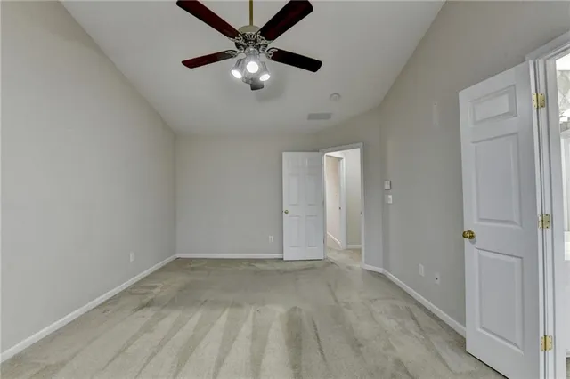 a spacious bathroom with a sink and a large mirror