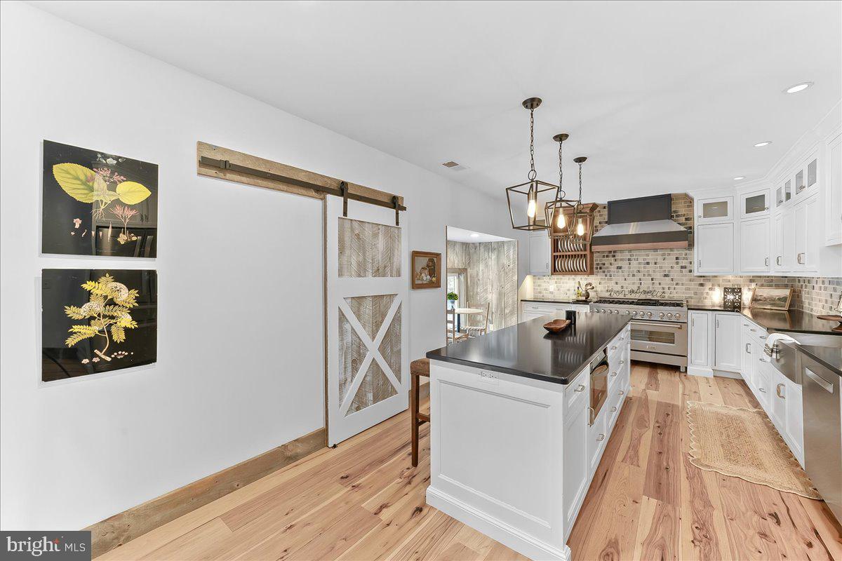 208 Haystack Lane Wilmington, DE 19807 - Photo 21 of 89 a kitchen with stainless steel appliances granite countertop a refrigerator a oven a sink a stove and a wooden floors