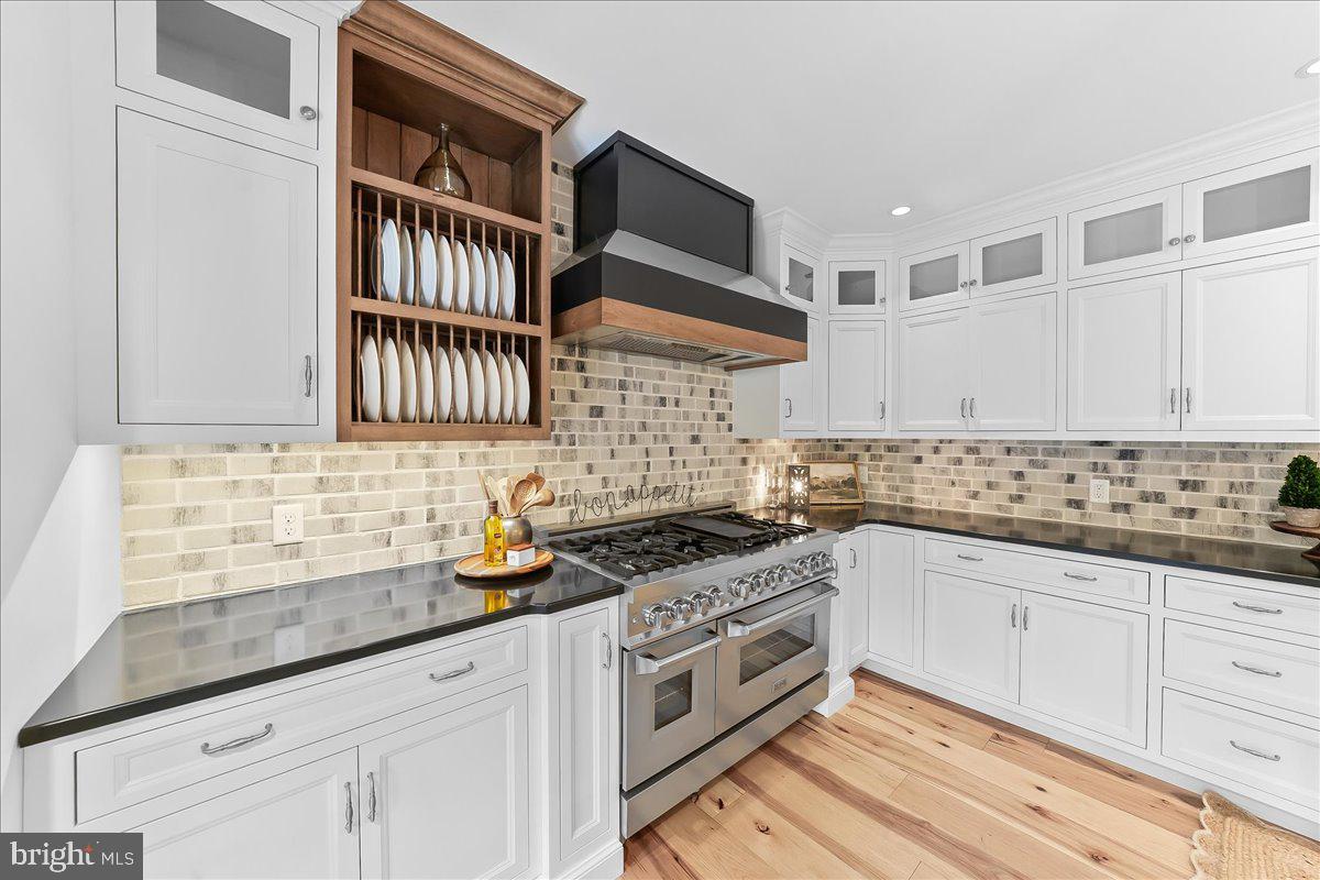 208 Haystack Lane Wilmington, DE 19807 - Photo 22 of 89 a kitchen with granite countertop a sink a stove and cabinets