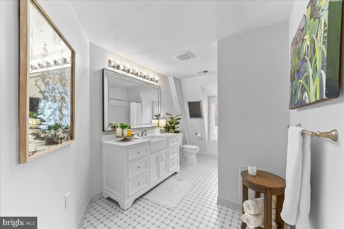 208 Haystack Lane Wilmington, DE 19807 - Photo 24 of 89 a kitchen with stainless steel appliances a stove a refrigerator a sink a dining table and chairs