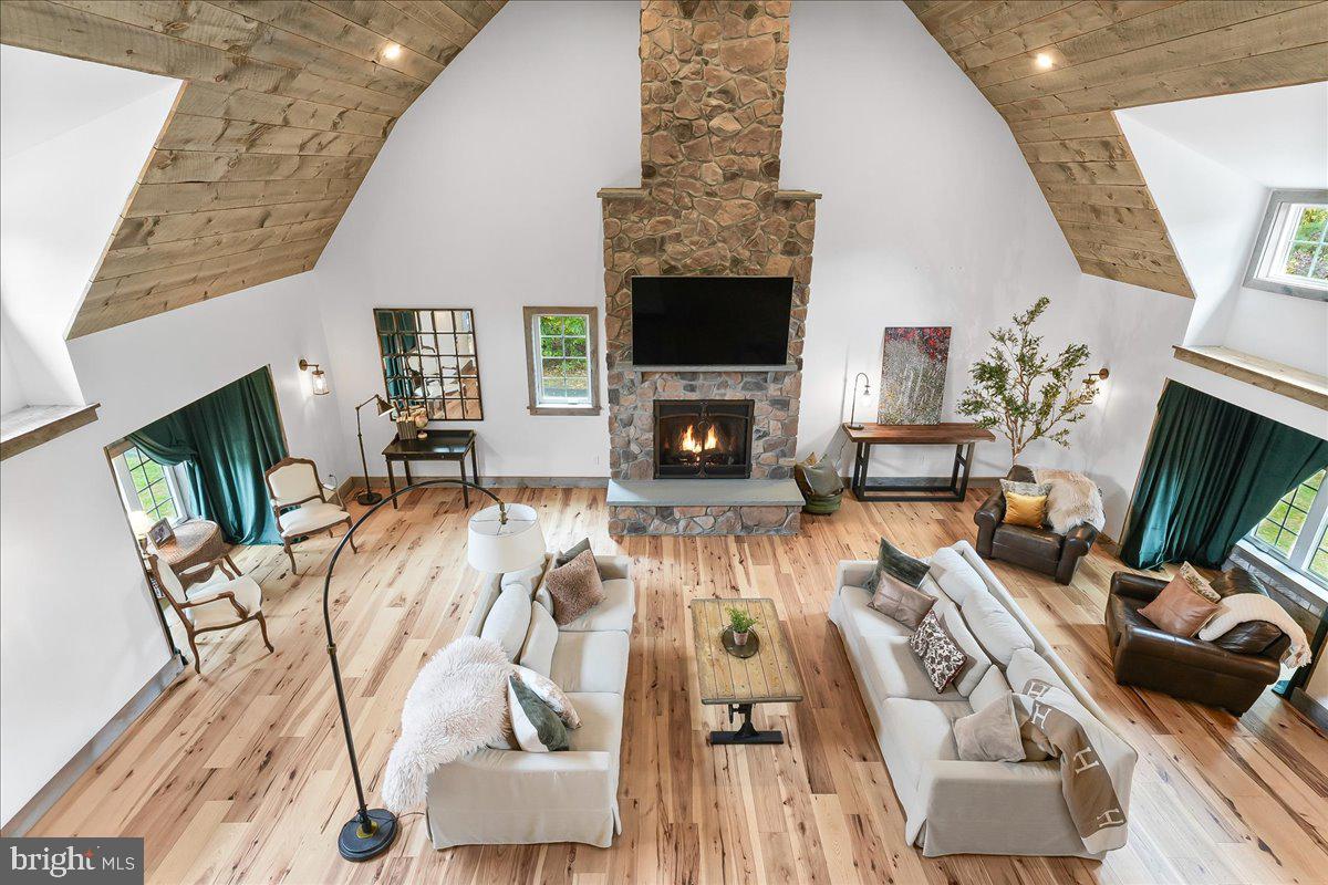 208 Haystack Lane Wilmington, DE 19807 - Photo 32 of 89 a living room with furniture a flat screen tv and a fireplace