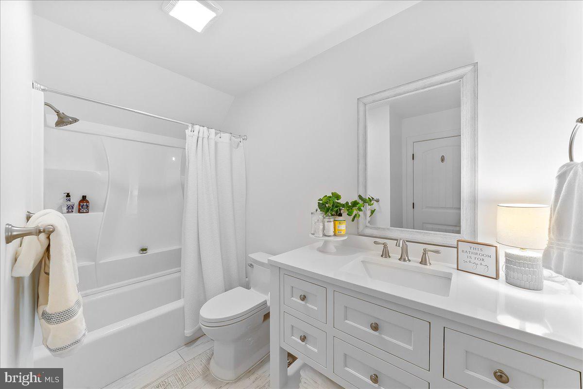 208 Haystack Lane Wilmington, DE 19807 - Photo 38 of 89 a bathroom with a granite countertop sink a toilet and shower