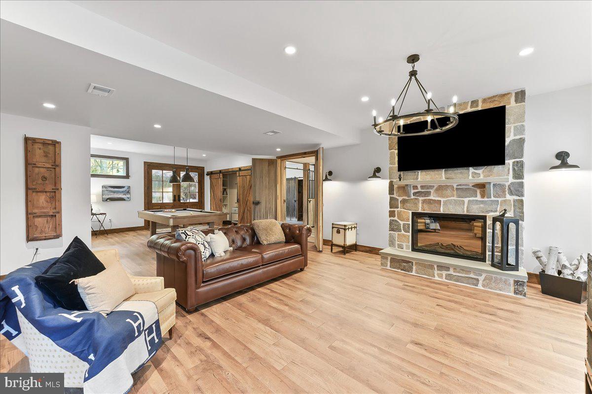 208 Haystack Lane Wilmington, DE 19807 - Photo 41 of 89 a living room with furniture a flat screen tv and a fireplace