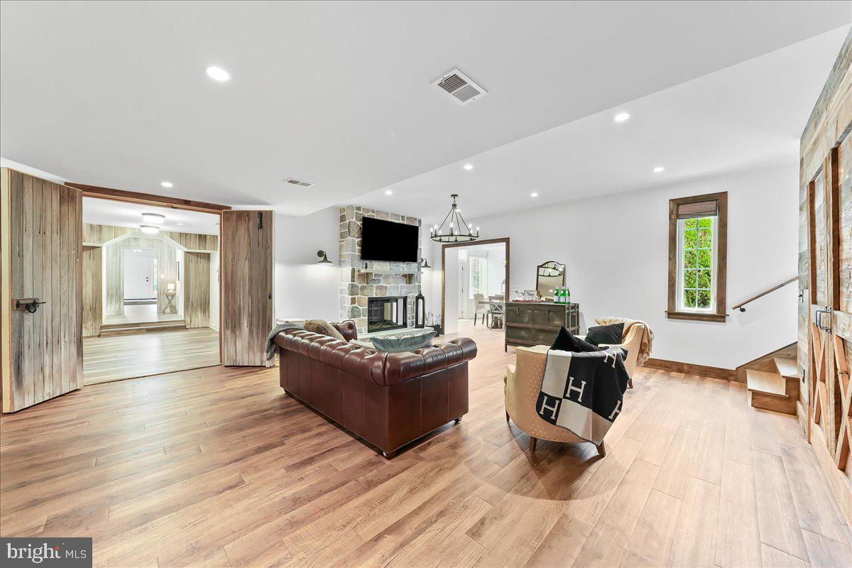 208 Haystack Lane Wilmington, DE 19807 - Photo 43 of 89 a living room with fireplace furniture and a wooden floor