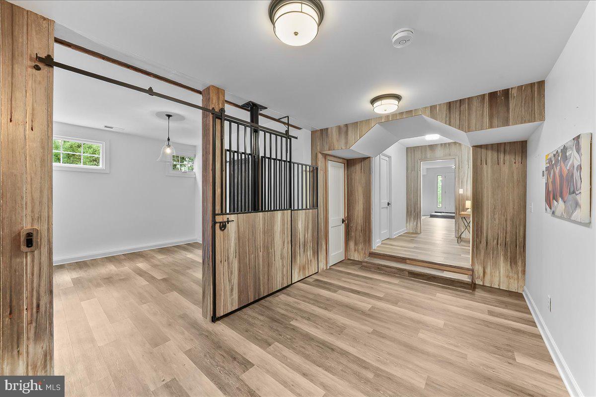 208 Haystack Lane Wilmington, DE 19807 - Photo 49 of 89 a view of a hallway with wooden floor and staircase