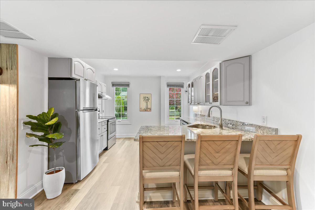 208 Haystack Lane Wilmington, DE 19807 - Photo 57 of 89 a dining room with furniture and a kitchen view