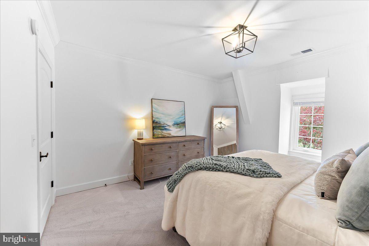 208 Haystack Lane Wilmington, DE 19807 - Photo 63 of 89 a bedroom with a bed and a chandelier