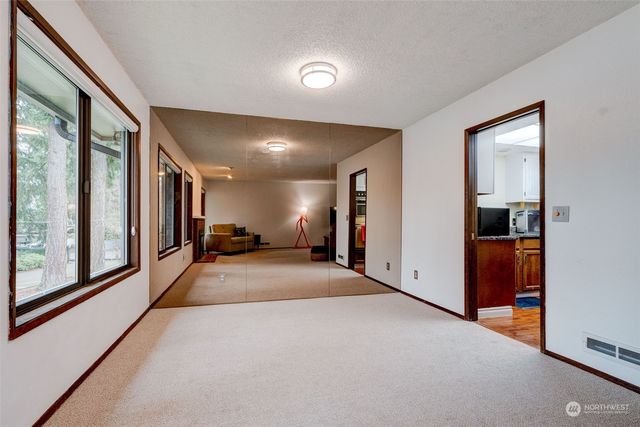 a view of a hallway with a large window