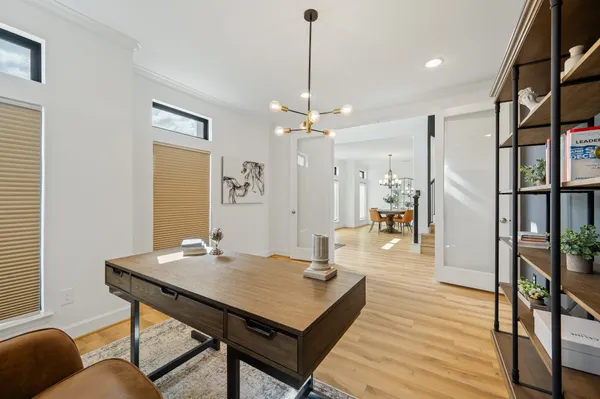 a view of a livingroom with furniture and hardwood floor