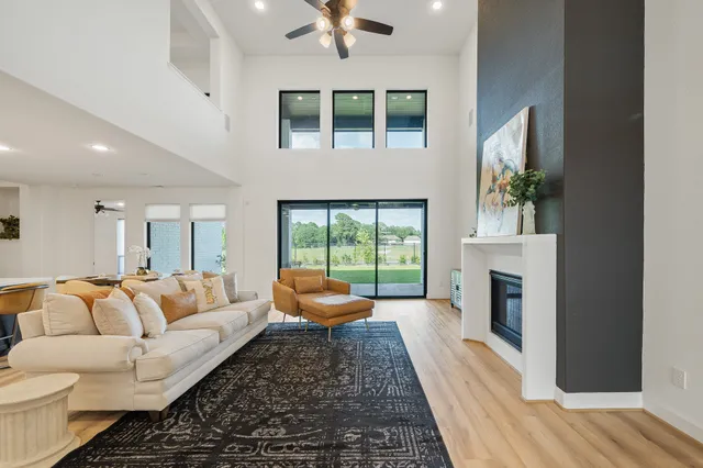 a kitchen with a stove a refrigerator and a dining table