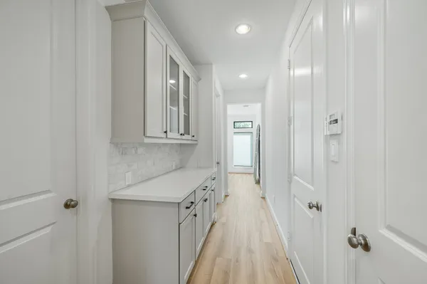 a bathroom with a sink a mirror and a shower