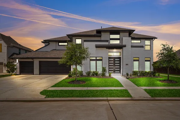 front view of a house with a yard