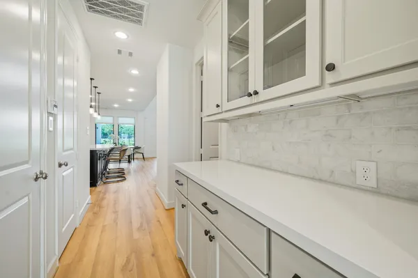 a view of a kitchen with a sink and dishwasher