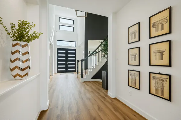a view of an entryway with wooden floor