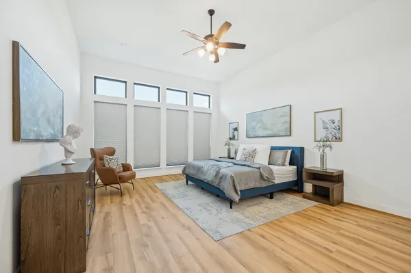 a bedroom with a bed and a table