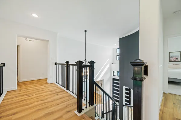 a view of a hallway with a flat screen tv