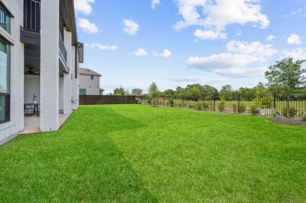 a view of a garden with a building in the background