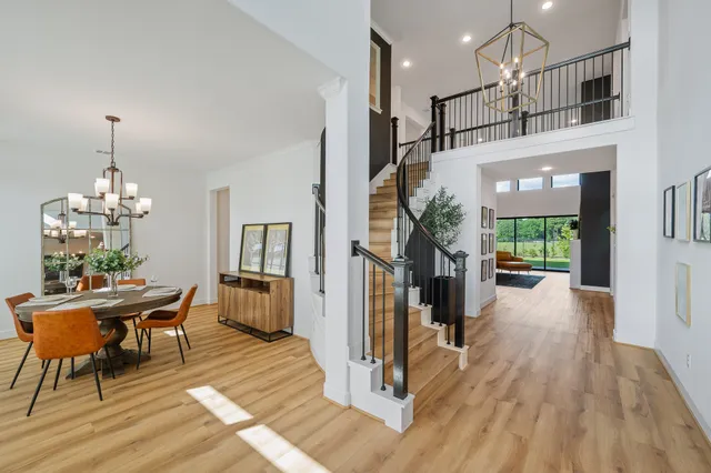 a view of a livingroom with furniture window and wooden floor