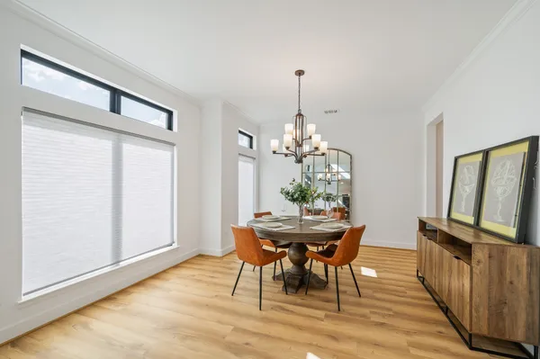 a view of a dining room with furniture window and wooden floor