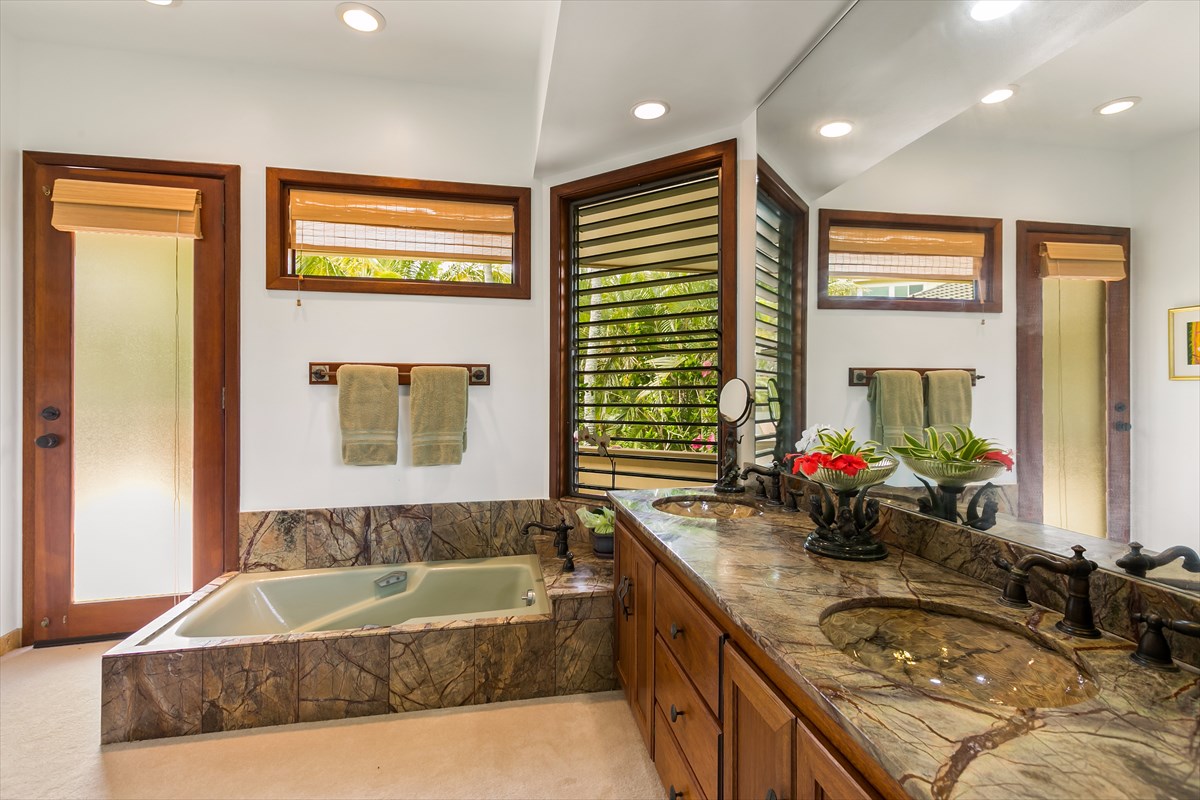 1516 Pe'e Road Koloa, HI 96756 - Photo 15 of 25 a bathroom with a granite countertop tub sink and mirror